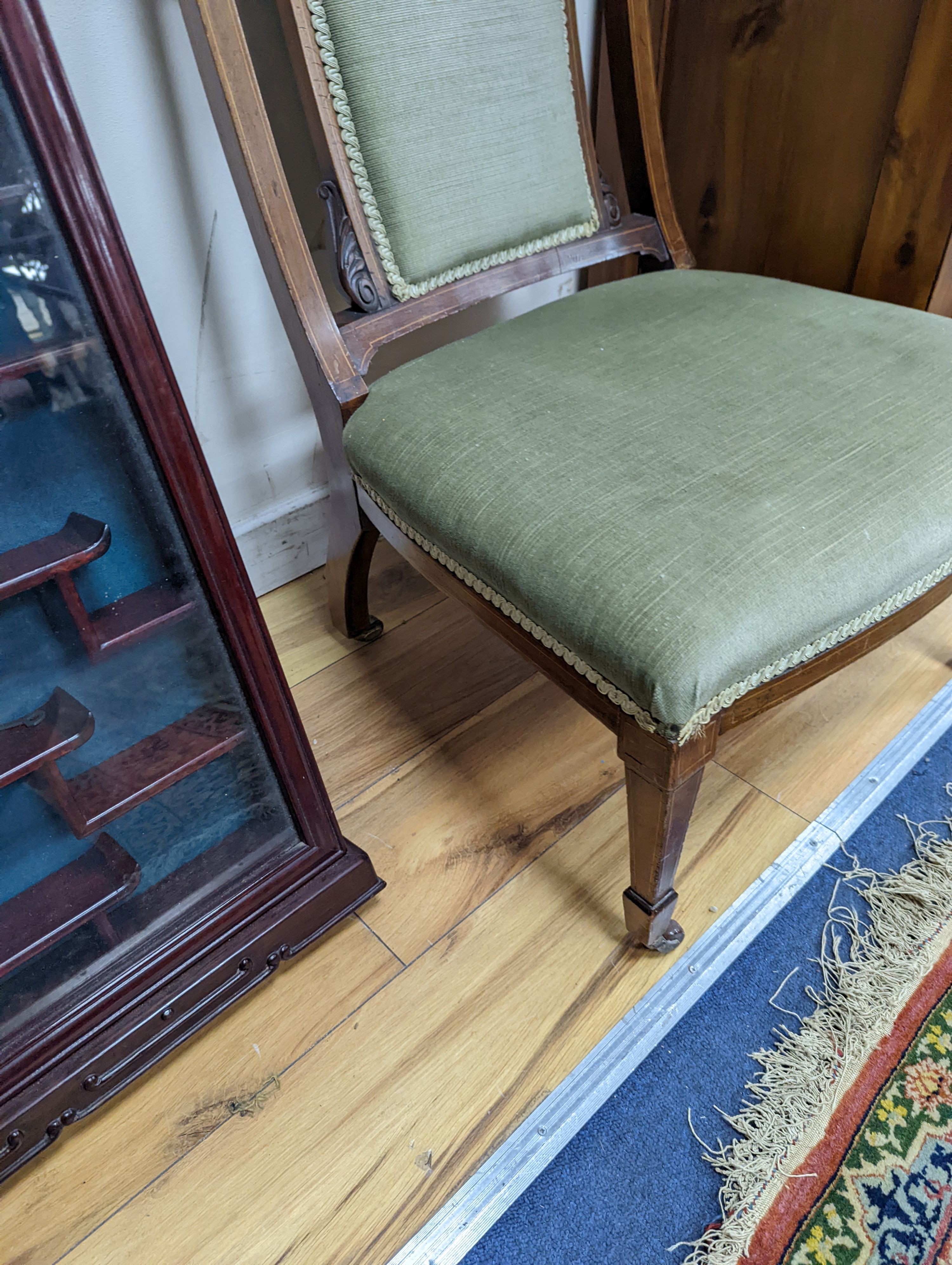 A late Victorian marquetry inlaid mahogany nursing chair